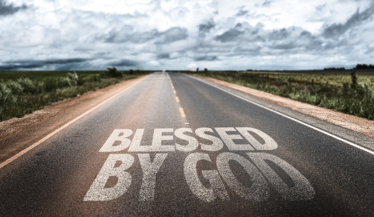 Blessed By God written on rural road
